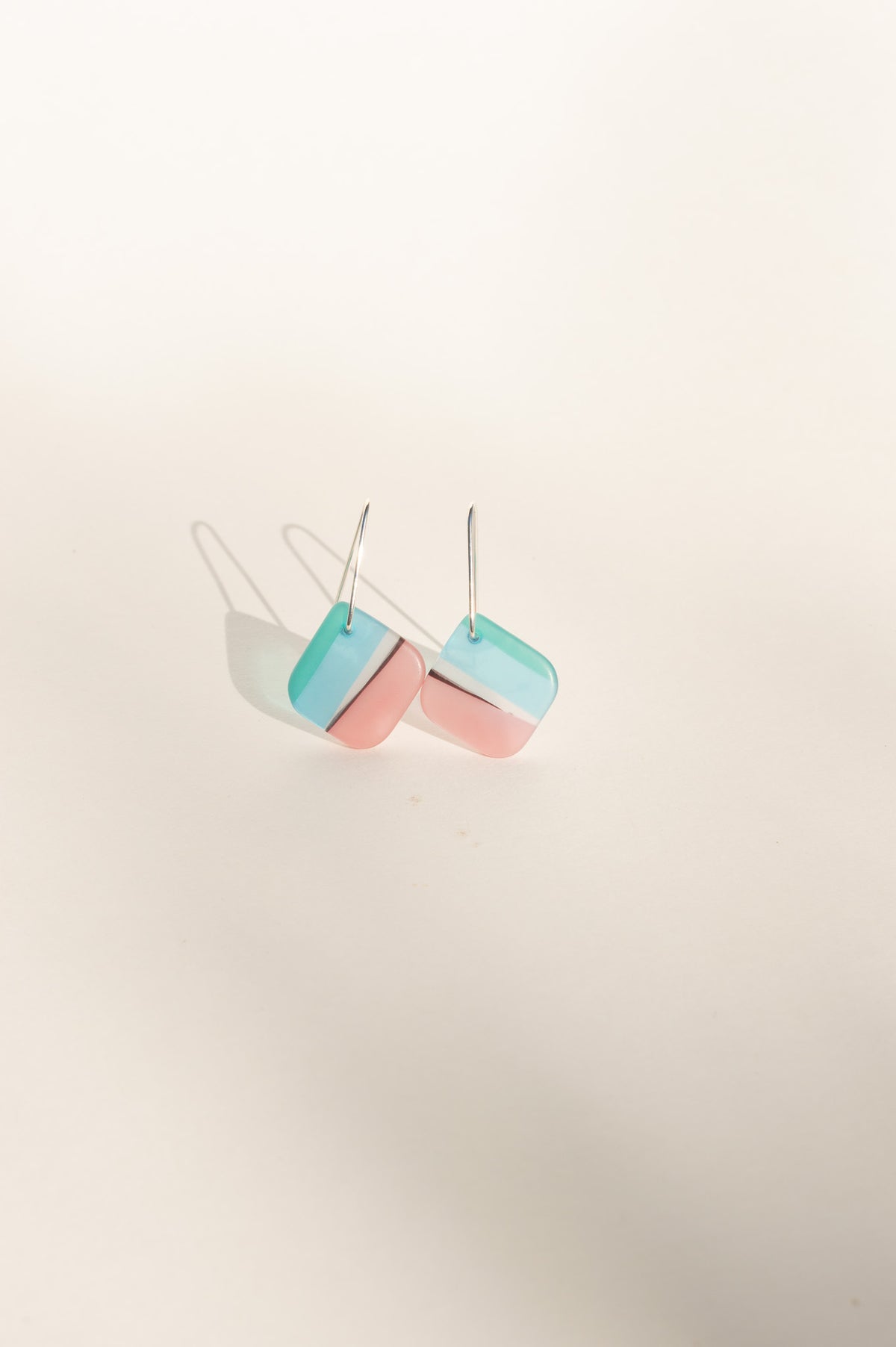 Daydream 5 small angled earrings in aqua and blush pink upcycled surfboard resin