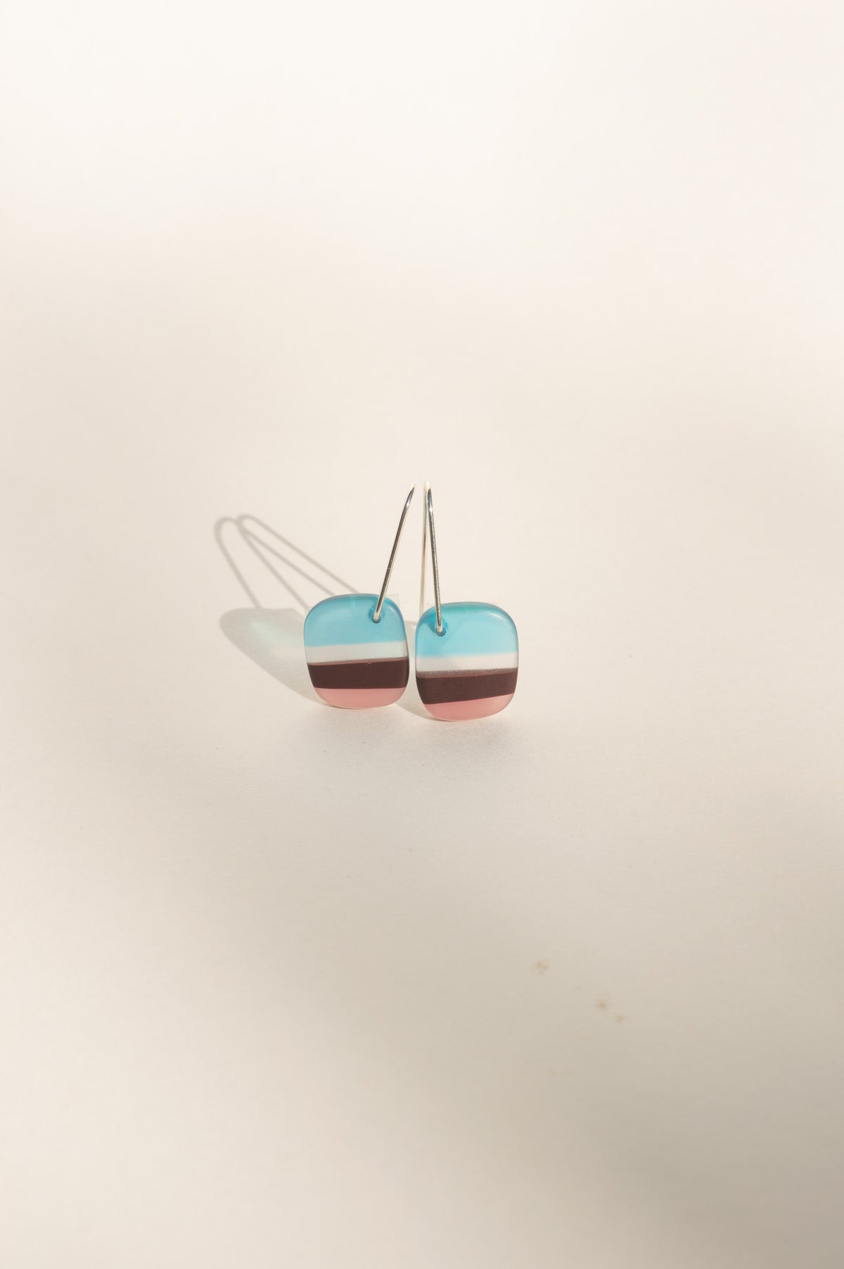 Daydream 6 extra small earrings with aqua, cocoa and pink stripes in upcycled surfboard resin